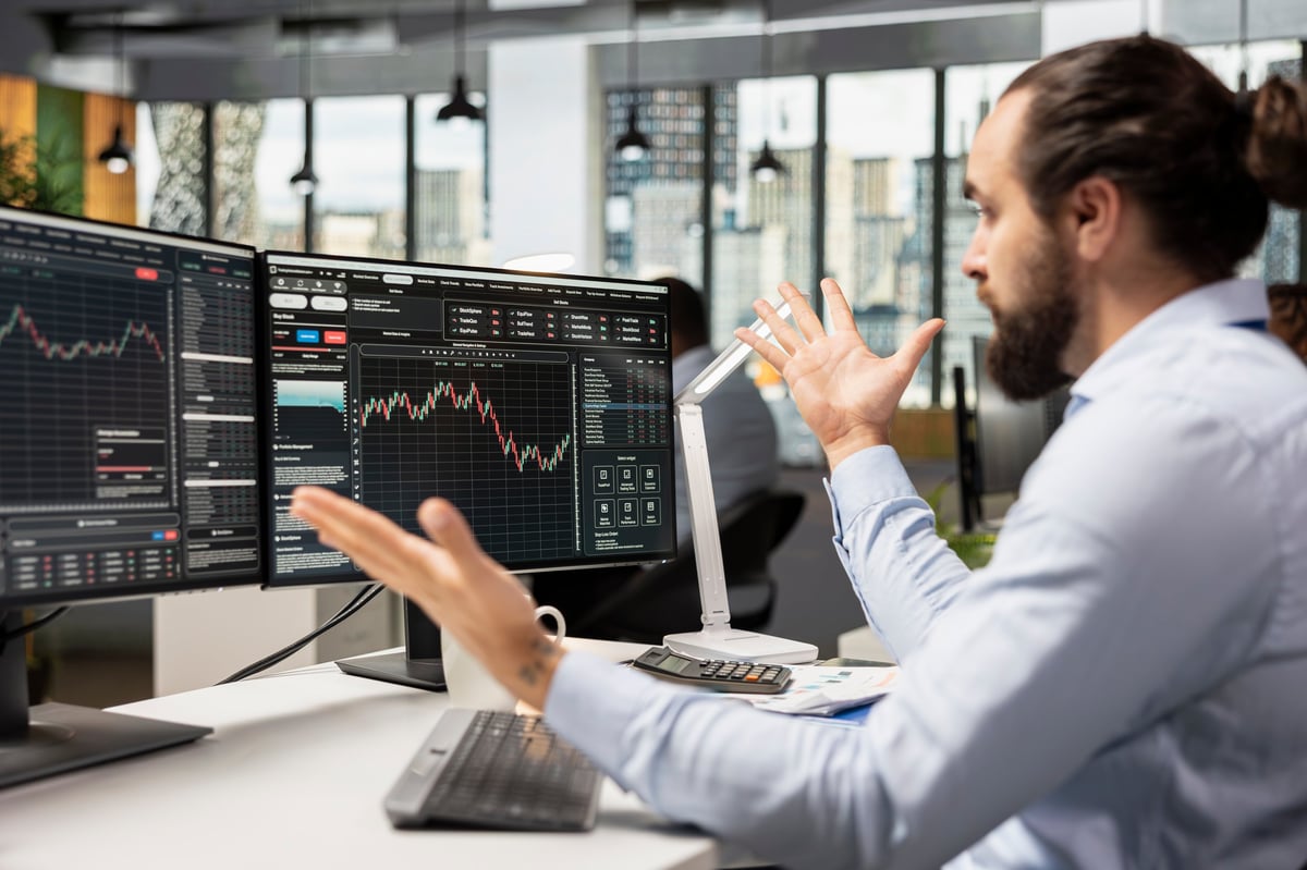 Options trader focused at his desk as the market moves